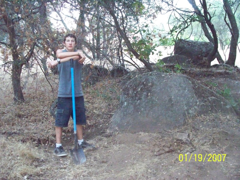brent standing next to the lil rock drop