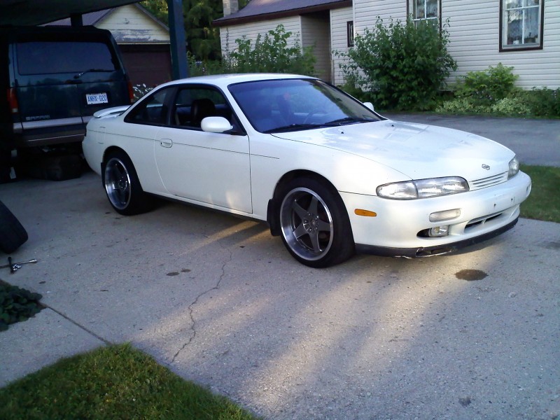 my 95 nissan 240sx with my 2 rear rims but one on the front to see how it will look when i get my front rims