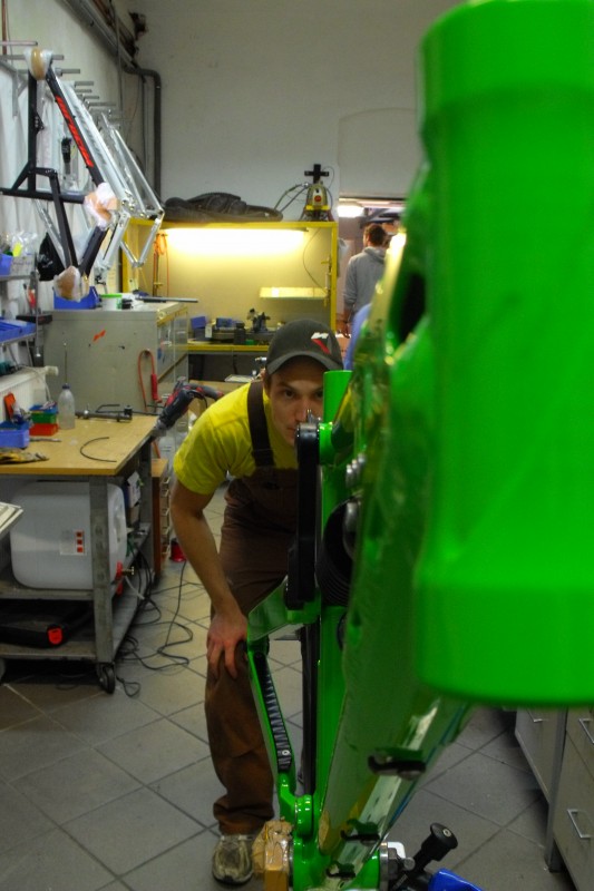 Jan checking and adjusting a frame. This green baby won't leave the room until it's perfectly true and straight