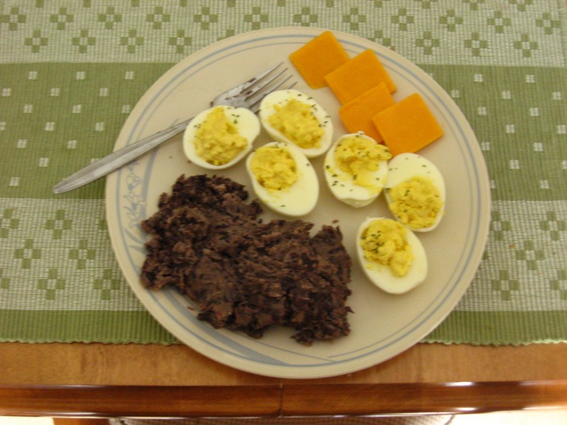 Deviled eggs, refried beans, and cheese