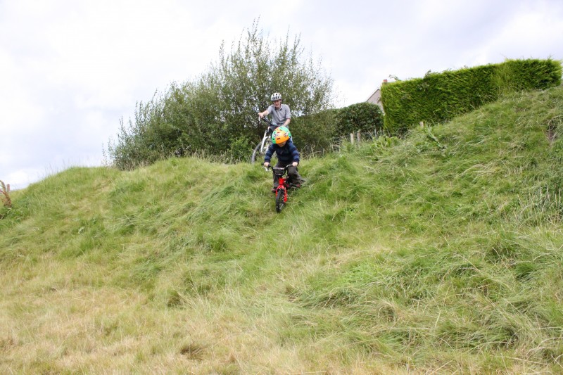 riding down steep bank on the side