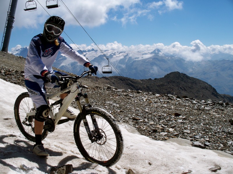 On the last bit of snow, of the mega track, 3300m up- kicking back with my orange. Photo by Hatch