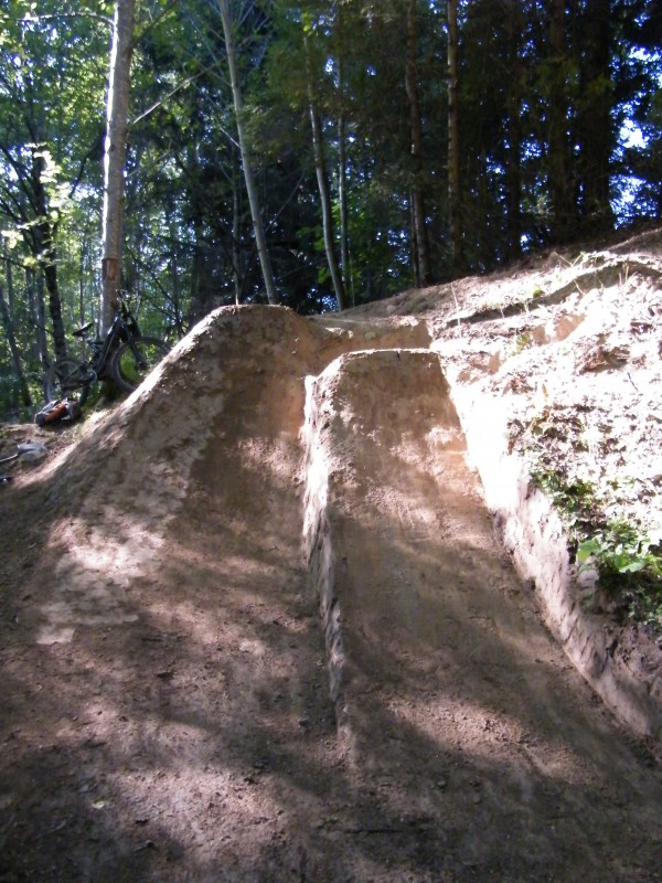 The two jumps at the bottom of the trail, the final feature.