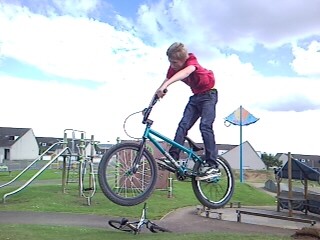 getting air of a little jump at the skatepark