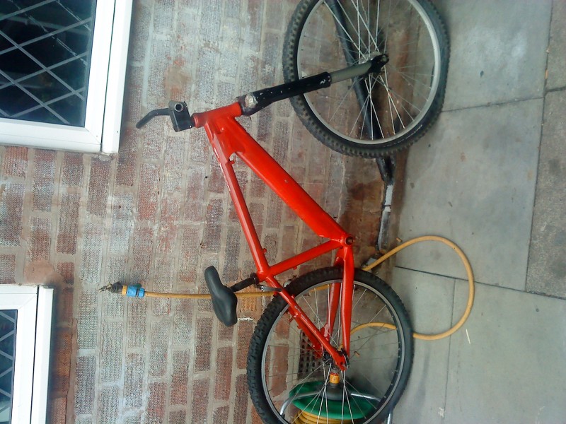 this is the bke wen i first gt it . painted in red about 50 times so it took me about 1 week to strip it back to bear metal. it had zoom upside down forks with a 20mm axle but im not using them so ther be for sale soon .it had  tioga headset and handle bars on which i mite use just got to get them powder coated.the bike has gt to have new wheels crank forks and paint job.