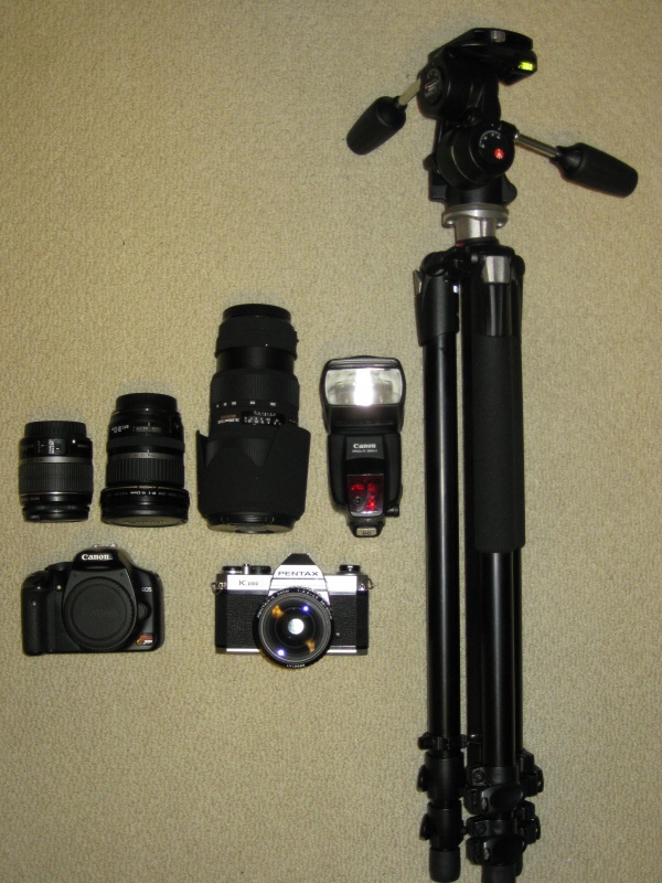 my arsenal! including a new manfrotto tripod, canon speedlite 580ex ll. sigma 70-200mm 2.8 lens. canon 10-22mm 3.5 lens, and the stock 18-55mm. Rebel xsi and pentax k1000 with 28-80mm lens.