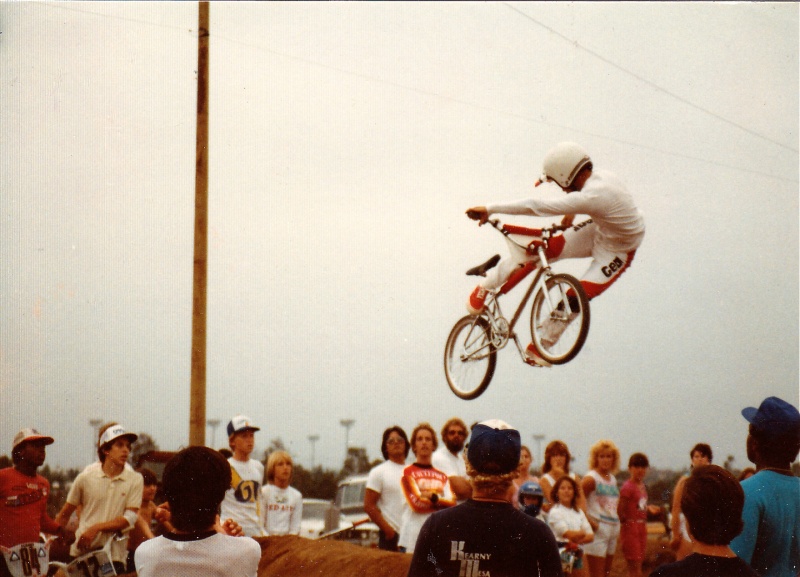 Circa 1984. Post race jump jam. Step-up into berm. w/ Mike King looking on. He's the one with his back shown wearing the white jersey.