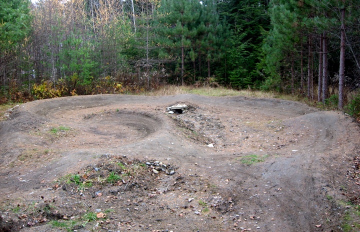 The backyard pump track is a work in progress in its first season. I'm still fine tuning and building, and I just recently scored some dirt and will begin to build it up more. Almost all of what you see here is from digging and moving "lawn", almost nothing "imported" at this point.