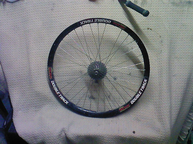 Sun Rims Double Track rim on a DMR revolver hub with a Sram 8 speed cassette, 135mm width 10mm axle