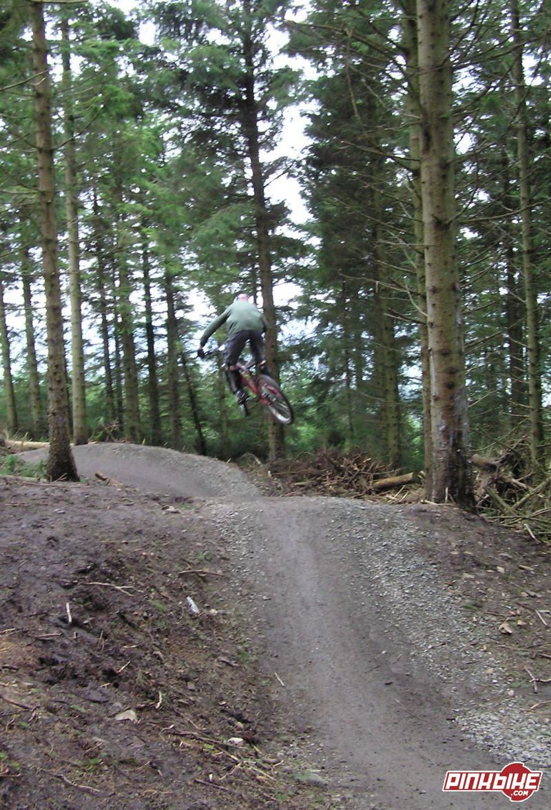 Downhill style whip with some nice air :) on the new upper red section at glentress.