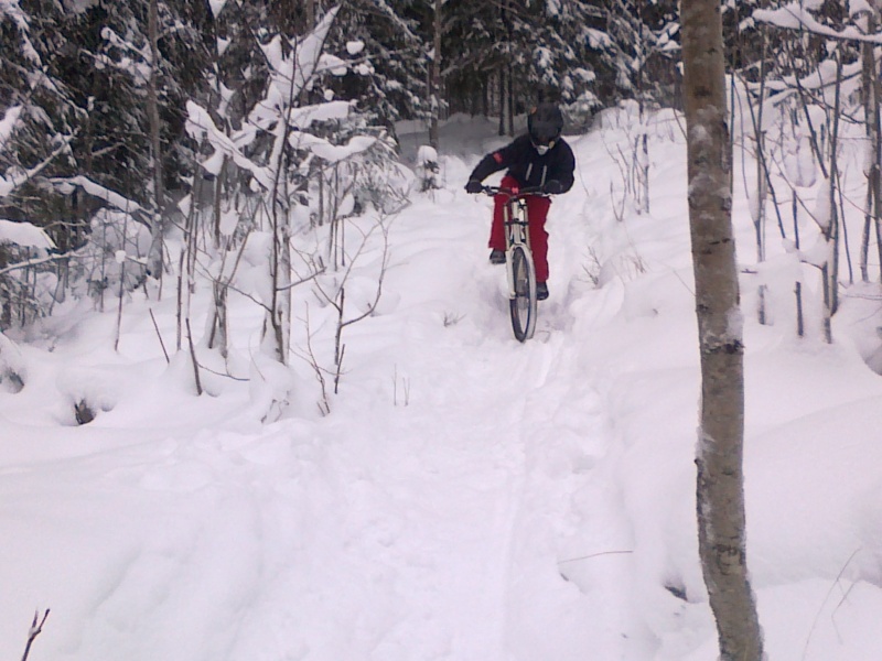 Shredding slippery home trail after snowy night.