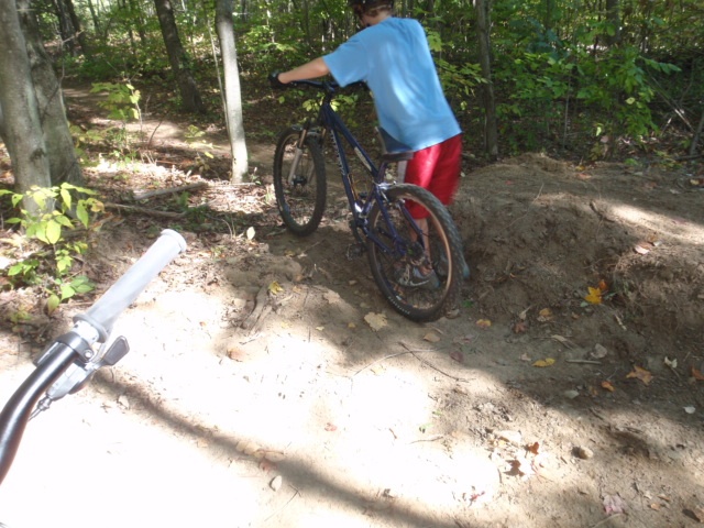 pushing my bike, first session with it at kyles before the jumps were bigger