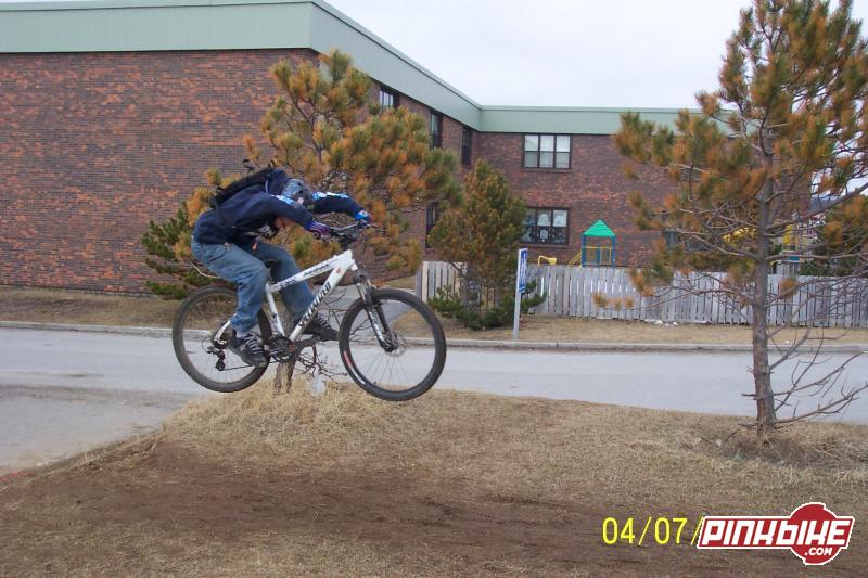 small air off a lil jump next to the school