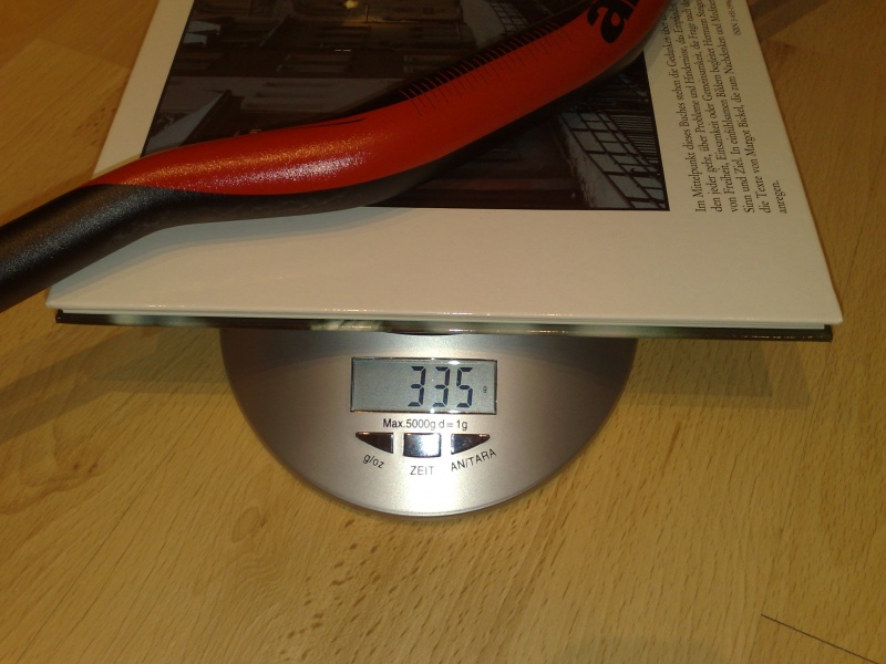 scale shot of a 2010 Answer Pro Taper DH 780mm 1" rise,

obviously the weight of the book's not included, go to love "high tech" scales :D