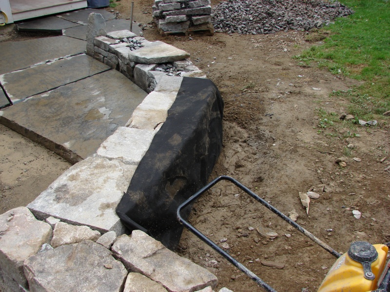 Stonewall dry lay with flagstone patio