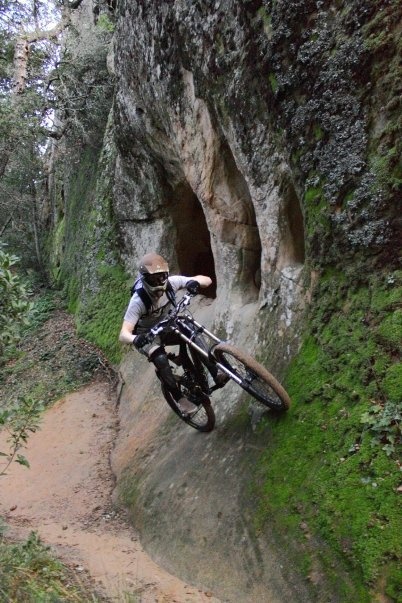 A rock face/ wallride near the bottom of a trail called Undercity.