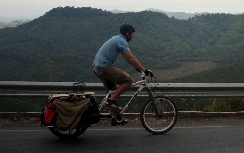 pedaling through the mountains in laos