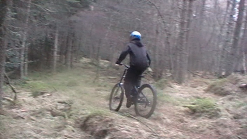 me riding my downhill bike (faith 3) on my newly finished trail