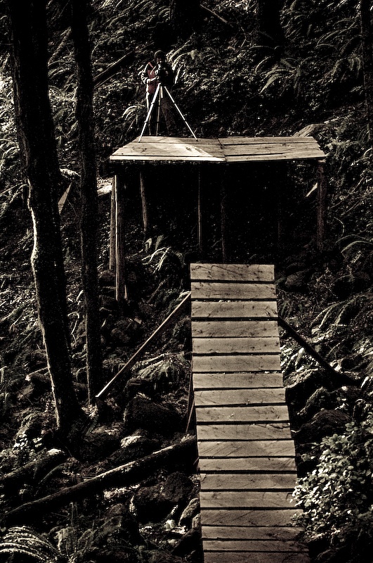 We'd been eying up this section of trail for Curtis to hit since we got here. Likely the biggest <br> stunts at Black Rock, this section consisted of a step down ladder stunt, to a long natural <br> table top, to this step up, to a road gap.