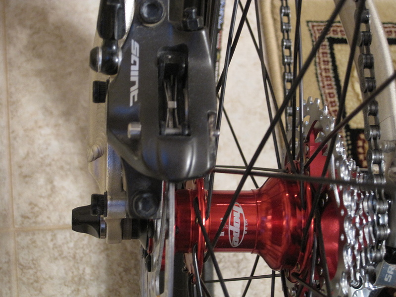 -Hope Pro II rear hub (red) laced on mavic ex721 hoops with sram pg-990 casette (red)
-Saint Caliper