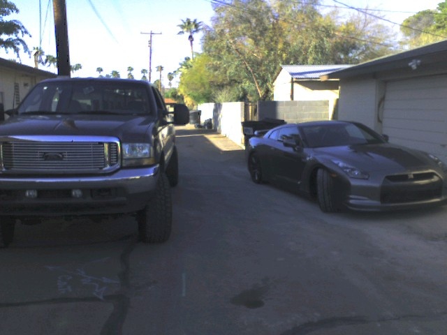 got the new GT-R to the right and F-350 shuttle rig to the left