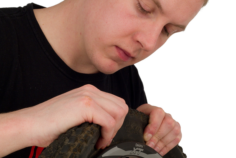 Check to be sure that no part of the tube has been pinched between the tire and rim