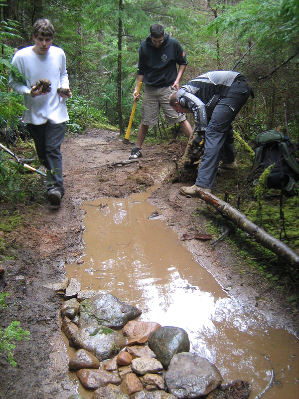 'Before' pic - Starting the armouring and drainage. The rocks not only protect the trail but also raise it slightly to allow water run-off.