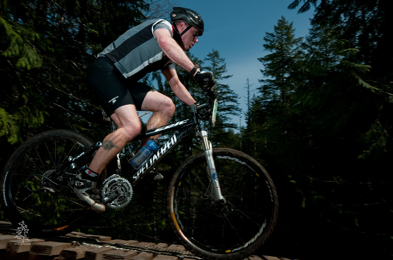 A rider crosses Sykes Bridge during the Island Cup XC race in Cumberland, BC on April 11th, 2010.