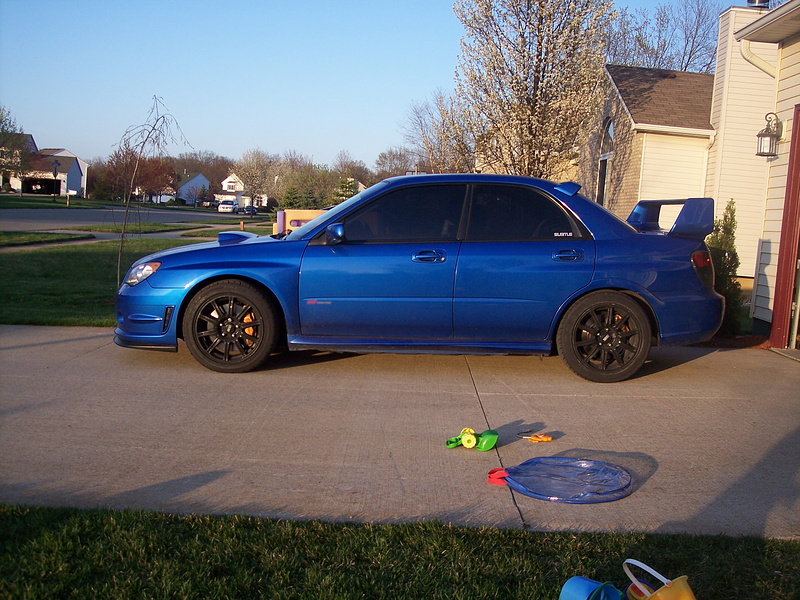 Picture of my 06STi after installing Swift STi springs and 3/8" rear saggy butt shims. It has since settled a little more. Now it has a 2-finger gap front and 1-finger gap rear.