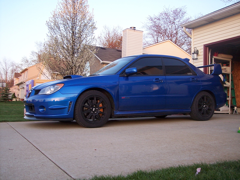 Picture of my 06STi after installing Swift STi springs and 3/8" rear saggy butt shims. It has since settled a little more. Now it has a 2-finger gap front and 1-finger gap rear.