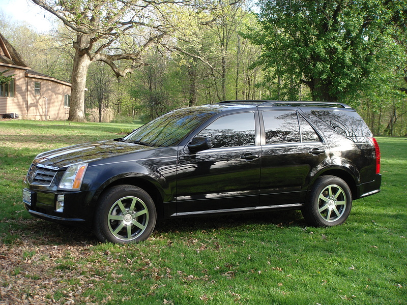 our 2004 Cadillac SRX V8 AWD. She only has 67K on the clock and I scooped up a 12mo 12K warranty. Capable of towing 4250 lbs! Magnetic Ride control with Stabiltrak and Sport Stick shifted 5sp auto trans. 18" wheels. Flowmasters installed and next will be an Eibach Pro spring kit droppn' her about 2" overall.