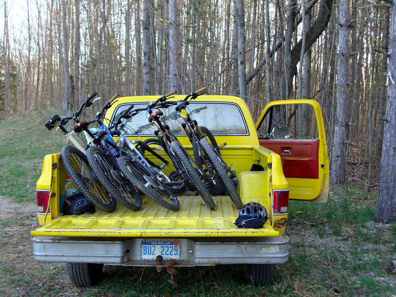 my buddy's yellow truck with our bikes after an xc ride