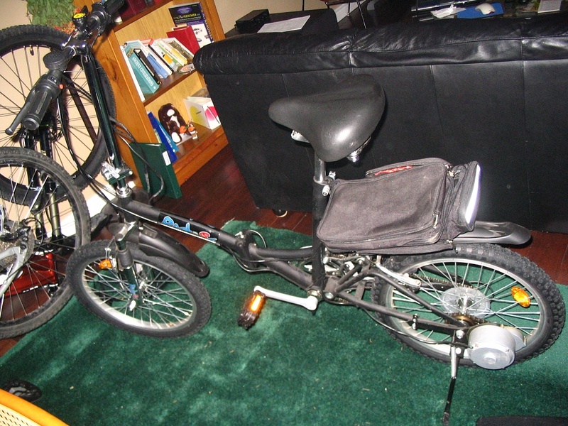First electric bike - heavy, unbalanced, top heavy with batteries on back rack.  Folding bike idea was stupid.