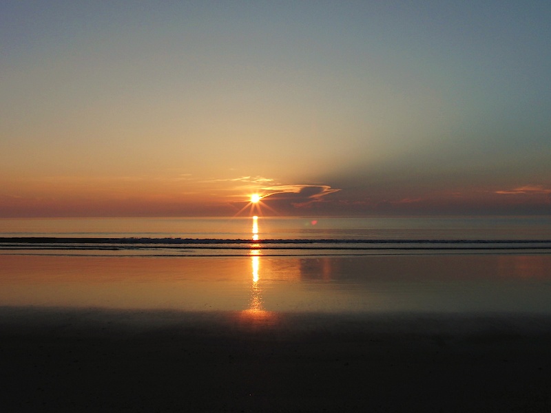 I couldn't find the better photos, but this is a sunrise over a beach near Daytona Florida.