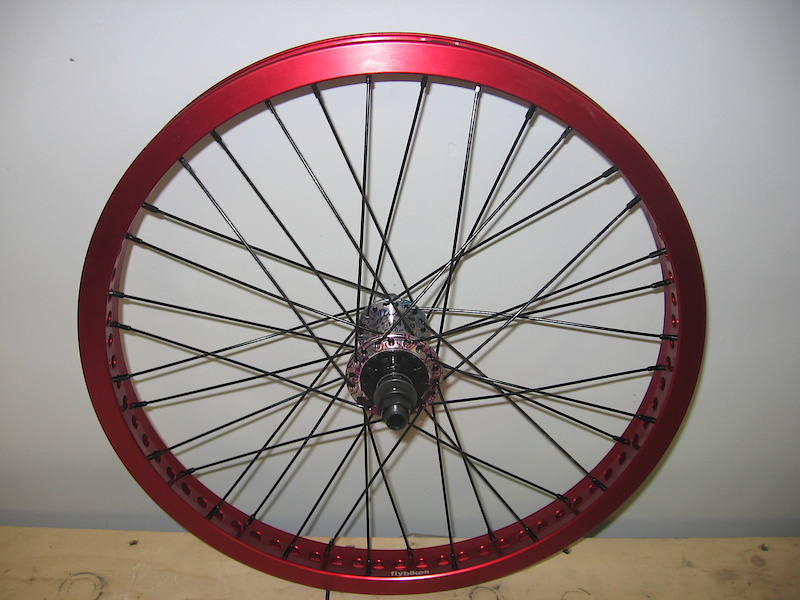 custom wheelset: madera hub, black spokes/nipple, fly rims red