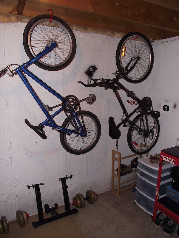 My basement work shop, the wall for hanging bikes, right now has my 1995 IronHorse Typhoon BMX, and my dads old bike.