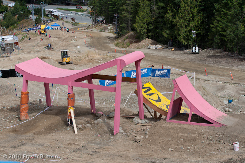 The whale tail step-up step-down was at the end of the course last year, but gets moved to a mid track position for 2010. Hidden beside the pink beast is the Mavic booter that may attract the big mountain riders, braaap!
