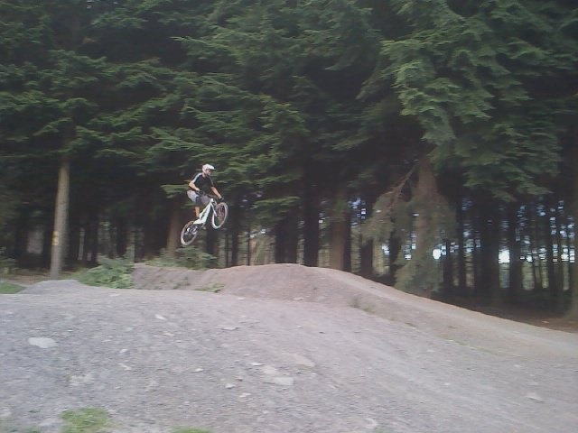 riding a bicycle down a track, pretty fun to be honest