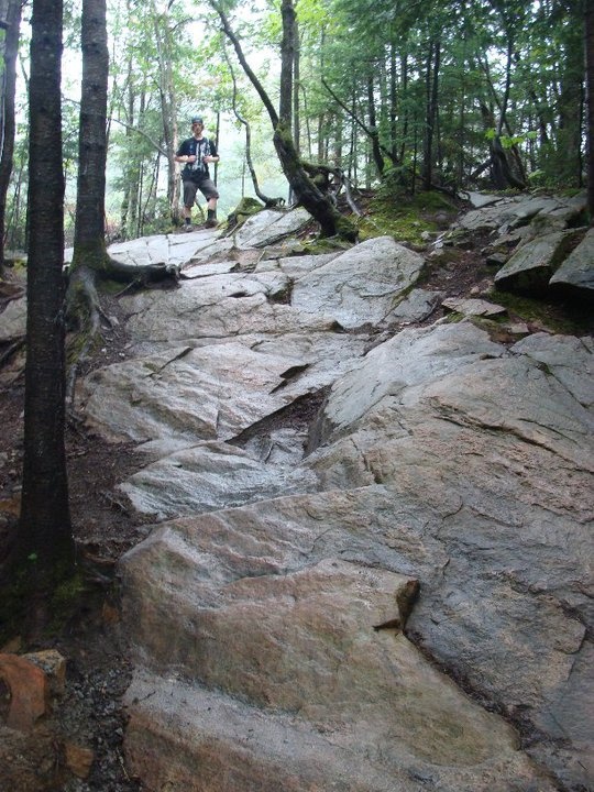 Another tight rock chute on the massive descent of the world's course.
