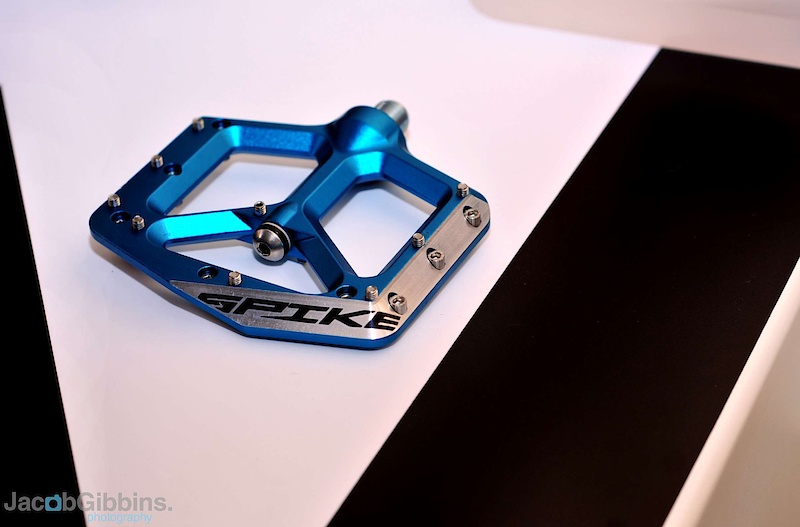 Is 2011 going to be the year of the pedal? We've seen a number of new options for the coming season, but the new Spank Spike pedal stands out from the crowd with their rather striking body profile and chamfered leading edges that are designed to glance off of whatever trail obstacle that you catch them on, as opposed to simply stopping you dead. I think we've all hit the deck hard from pedal strikes, you're on the ground before you knew what hit you, so I'm all for anything that lessens the chance of that happening. Further helping the cause is the slim body height, measured out at a thin 12 mm. The Spike's spin on a combination of oversized, sealed bearings and IGUS bushings that allow the pedal body to have a thinner footbed, but it flares out to house the bearing close to the crankarm. There are 18 pins per side, with all but the single central pin threading in from the opposite side to make removal of damaged pins easier, and they weigh in at a competitive 400 grams. MSRP starts at $119 USD.