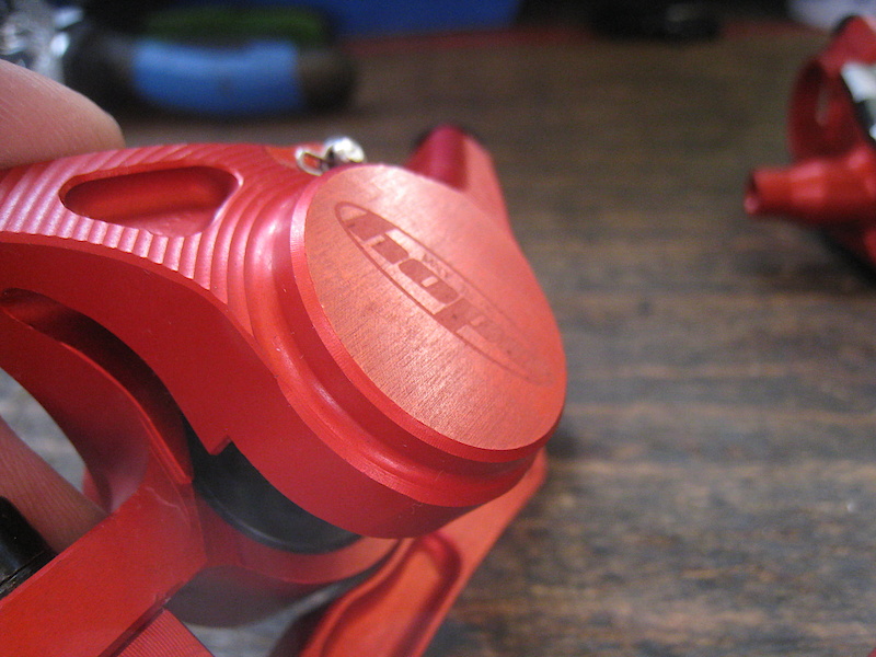 close up of my new rebuilt Hope V2 disc brake. With a beautifull red anodization.