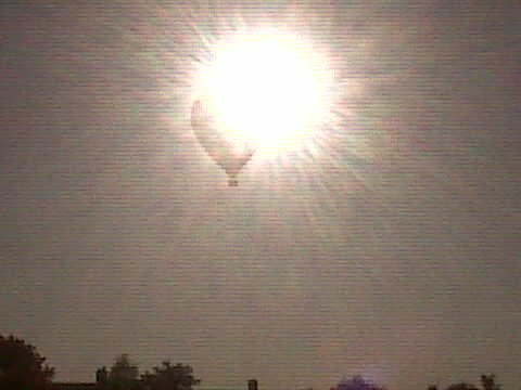 Balloon crossing the sun.