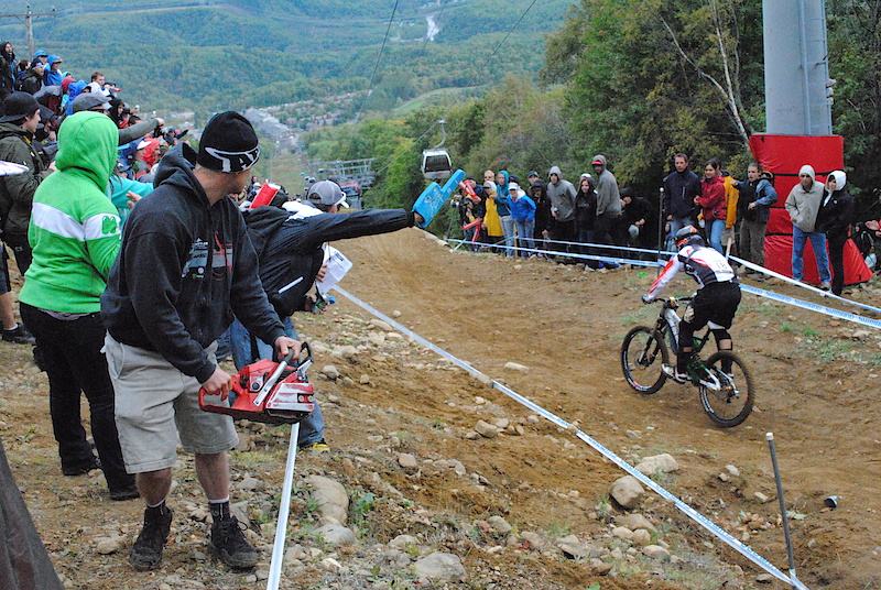 Guy cheering with is chain saw :tup: at UCI World Championships Mont Saint Anne