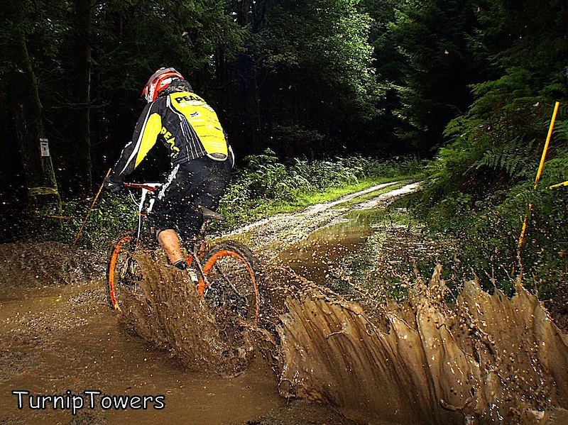 This mud puddle appeared quite suddenly during the practice session at Bucknell, as rainwater poured down the uplift road. This meant that by the time riders realized that it was there, they were already in it so I managed to get quite a few shots although I got soaked in the process! This is Zac Emmett soaking me.
