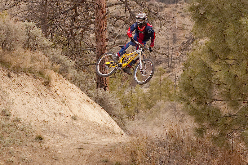 Tyler pulling a big whip over a huge table in the Kamloops Bike Ranch