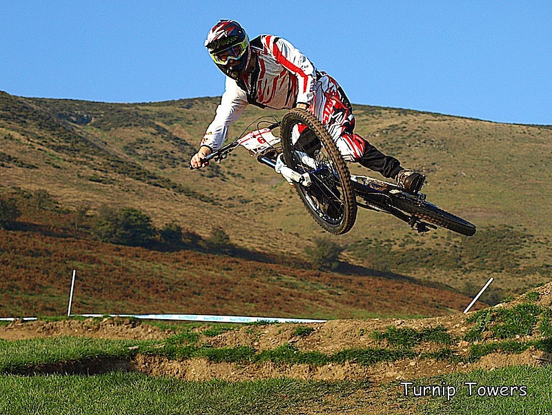 Some new berms have been added at Moelfre Hall this year, and this one ends in a small step-down which is great for shots like this. Nothing too fussy, just Si Parsons looking good for the camera with a good background.