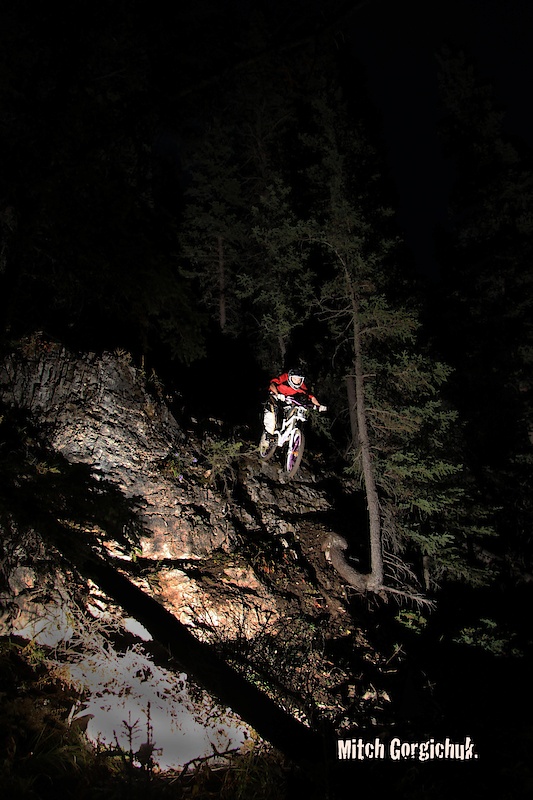 Breaking in the new drop line on SLF. Its got a super butter landing if you can avoid the large rocks, stump and a couple holes near the run out. Riding with no lights and getting blinded by the remote flash. Thumbs up!! 
Photo was Taken by Rueben and his Camera. 
Edit was done by Zackery