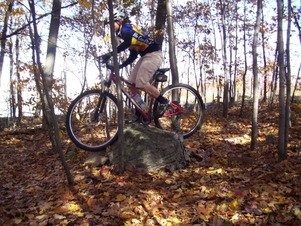 riding a rock between 2 small trees on a 90 degree turn..