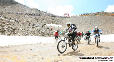 Some of the last riders coming through the snow field...