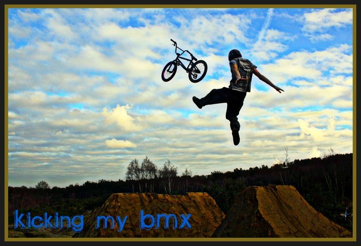Kicking my BMX on a jump I and mates built at M3s